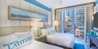 Day room with queen beds at Margaritaville Resort Times Square.