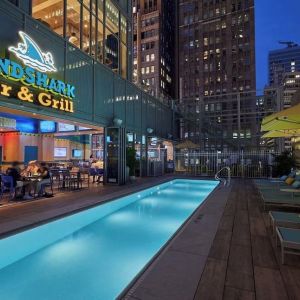 Outdoor pool at night at Margaritaville Resort Times Square.