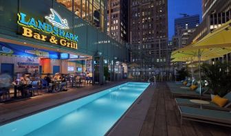 Outdoor pool at night at Margaritaville Resort Times Square.