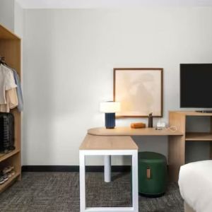 Day room with TV at Spark By Hilton Kannapolis.