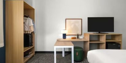 Day room with TV at Spark By Hilton Kannapolis.