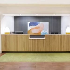 Reception and snack bar at Spark By Hilton Kannapolis.
