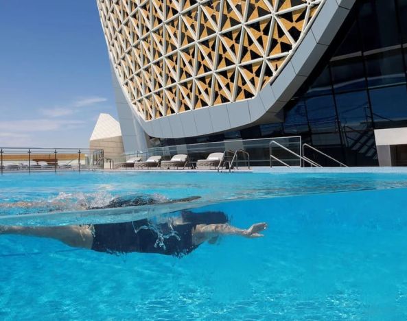 Outdoor pool at Velero Hotel Doha Lusail.