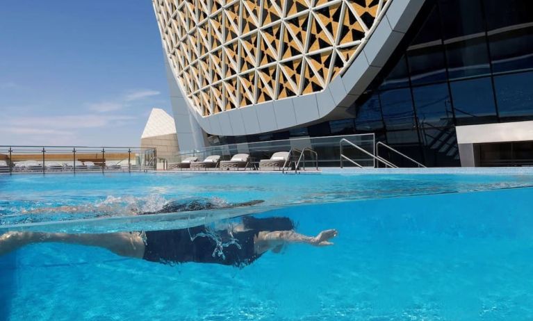 Outdoor pool at Velero Hotel Doha Lusail.