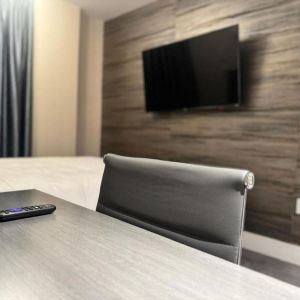 Day use room's include workdesk, private bathroom  and TV screen at Rose Hotel, Bronx.