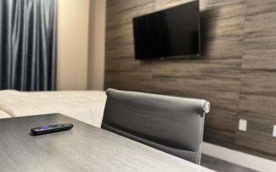 Day use room's include workdesk, private bathroom  and TV screen at Rose Hotel, Bronx.