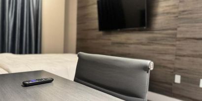 Day use room's include workdesk, private bathroom  and TV screen at Rose Hotel, Bronx.