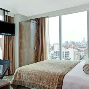 Day room with TV at Wyndham Garden Chinatown NYC.
