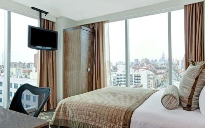 Day room with TV at Wyndham Garden Chinatown NYC.