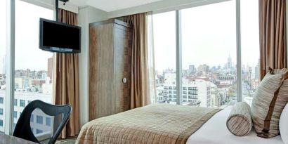 Day room with TV at Wyndham Garden Chinatown NYC.