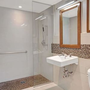 Guest bathroom with shower at Wyndham Garden Chinatown NYC.