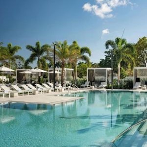 Refreshing outdoor pool surrounded by sun loungers at Renaissance Boca Raton Hotel.
