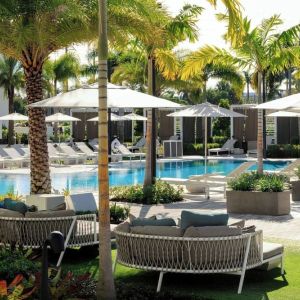 Lounge chairs beside the pool at Renaissance Boca Raton Hotel.
