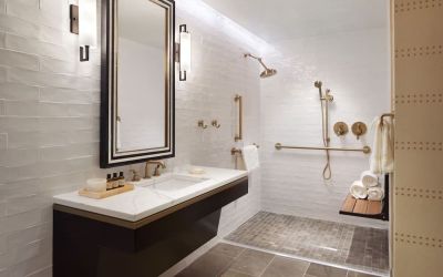 Guest bathroom with shower at The Plaza Pioneer Park, El Paso.