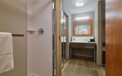 Guest bathroom with shower at Hampton Inn & Suites Providence/Smithfield.