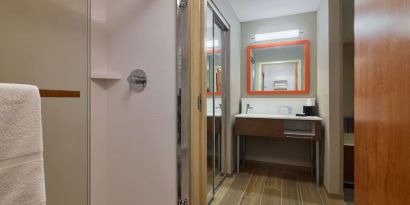 Guest bathroom with shower at Hampton Inn & Suites Providence/Smithfield.