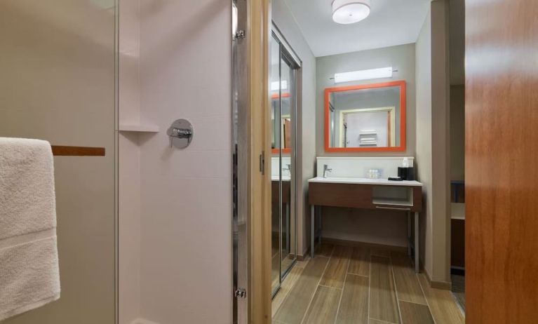 Guest bathroom with shower at Hampton Inn & Suites Providence/Smithfield.
