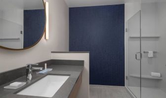 Guest bathroom with shower at Fairfield Inn & Suites By Marriott Kenosha Pleasant Prairie.