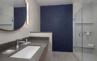 Guest bathroom with shower at Fairfield Inn & Suites By Marriott Kenosha Pleasant Prairie.