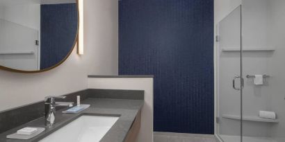 Guest bathroom with shower at Fairfield Inn & Suites By Marriott Kenosha Pleasant Prairie.