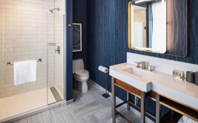 Private guest bathroom with shower at Rand Tower Hotel, Minneapolis, A Marriott Tribute Portfolio Hotel.