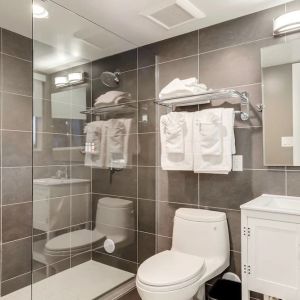 Guest bathroom with shower at Plunge Beach Resort.