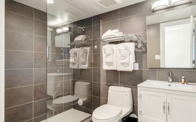 Guest bathroom with shower at Plunge Beach Resort.
