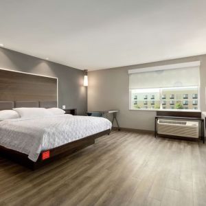 Spacious delux king bed with work desk at Tru By Hilton Wichita Northeast.
