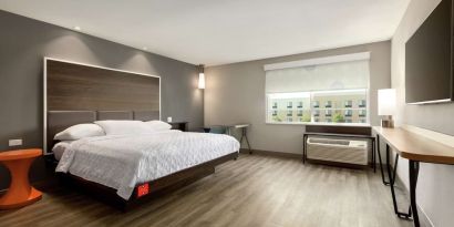 Spacious delux king bed with work desk at Tru By Hilton Wichita Northeast.
