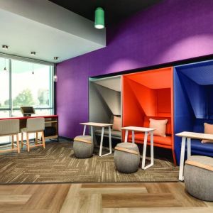 Comfortable working space with natural light at Tru By Hilton Wichita Northeast.
