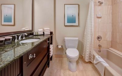 Private guest bathroom with free toiletries at Embassy Suites By Hilton San Diego-La Jolla.