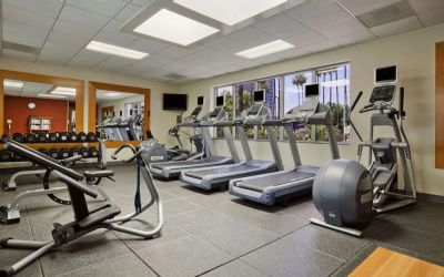 Fully equipped fitness center at Embassy Suites By Hilton San Diego-La Jolla.