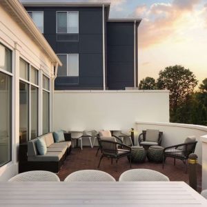 Outdoor terrace with lounge seating at Hilton Garden Inn Kennett Square.
