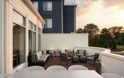 Outdoor terrace with lounge seating at Hilton Garden Inn Kennett Square.