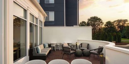 Outdoor terrace with lounge seating at Hilton Garden Inn Kennett Square.