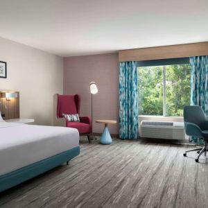 Bright and spacious day use room with work desk and lounge seating at Hilton Garden Inn Kennett Square.