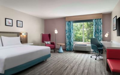 Bright and spacious day use room with work desk and lounge seating at Hilton Garden Inn Kennett Square.