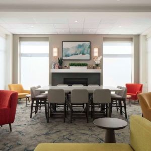 Lobby lounge with comfortable seating and workspace at Hilton Garden Inn Kennett Square.