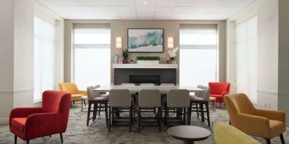 Lobby lounge with comfortable seating and workspace at Hilton Garden Inn Kennett Square.