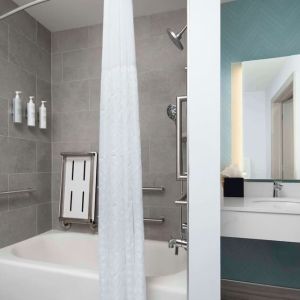 Private guest bathroom with convined tub and shower at Hilton Garden Inn Kennett Square.
