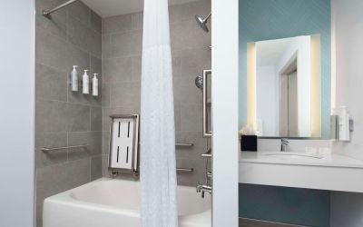 Private guest bathroom with convined tub and shower at Hilton Garden Inn Kennett Square.