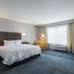Spacious day use room with king bed at Hampton Inn Chicago North/Loyola Station.