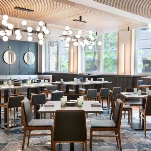 Dining area perfect for coworking at The Slate Denver, Tapestry Collection By Hilton.
