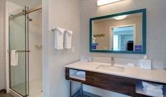 Guest bathroom with shower at Hampton Inn & Suites Sunnyvale Silicon Valley.