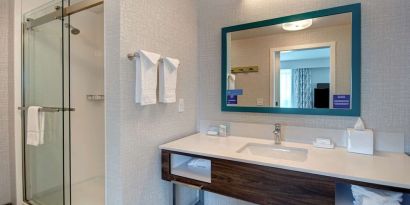 Guest bathroom with shower at Hampton Inn & Suites Sunnyvale Silicon Valley.