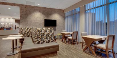 Lobby and coworking lounge at Hampton Inn & Suites Sunnyvale Silicon Valley.
