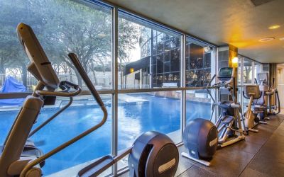Fitness center overlooking the pool at Hilton Dallas Lincoln Centre.