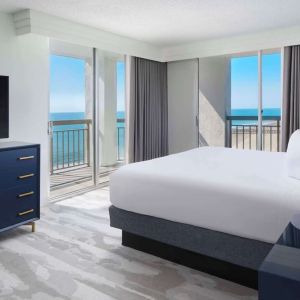 Day use room with balcony overlooking the ocean at Embassy Suites By Hilton Myrtle Beach Oceanfront Resort.