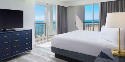 Day use room with balcony overlooking the ocean at Embassy Suites By Hilton Myrtle Beach Oceanfront Resort.
