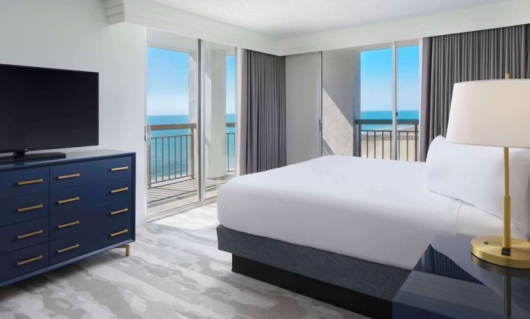 Day use room with balcony overlooking the ocean at Embassy Suites By Hilton Myrtle Beach Oceanfront Resort.